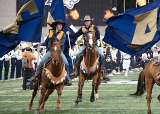 Rafe rides for Bobcat Football.jpg